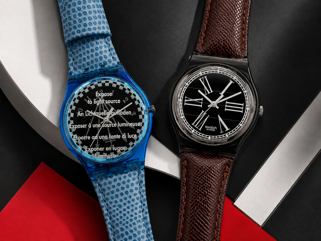 Vintage Swatch Solar watches displayed in a red black and white collector composition