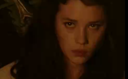 beautiful girl with long hair who is opening her shirt and showing her boobs.