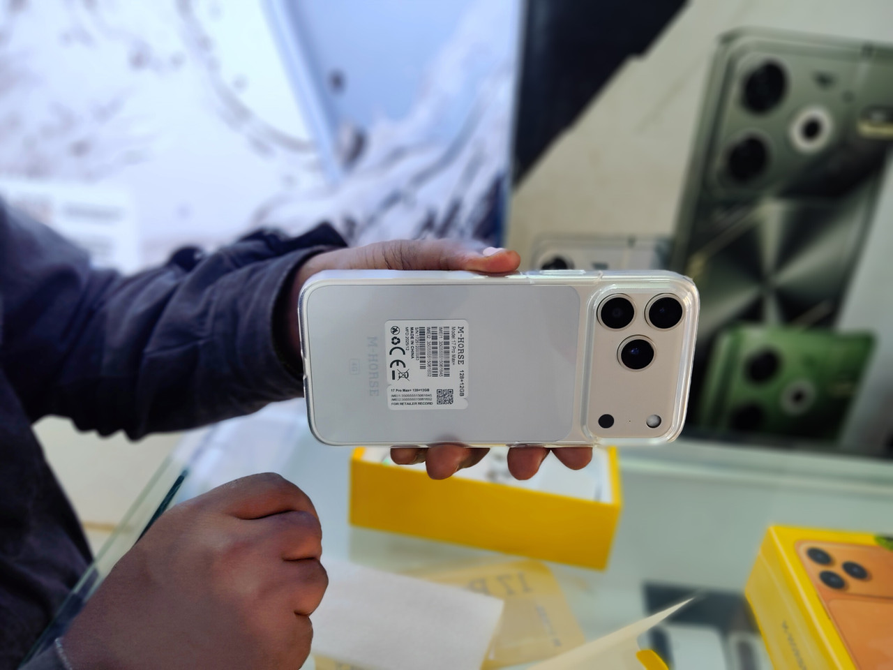 Person thoughtfully reviewing phone options for disciplined decision