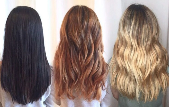 Long straight dark hair transition to wavy blonde hair
