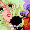 Kanae staring in fear & horror straight ahead, while "Mamiya" smiles a cruel smile & holds a black rose in front of her.