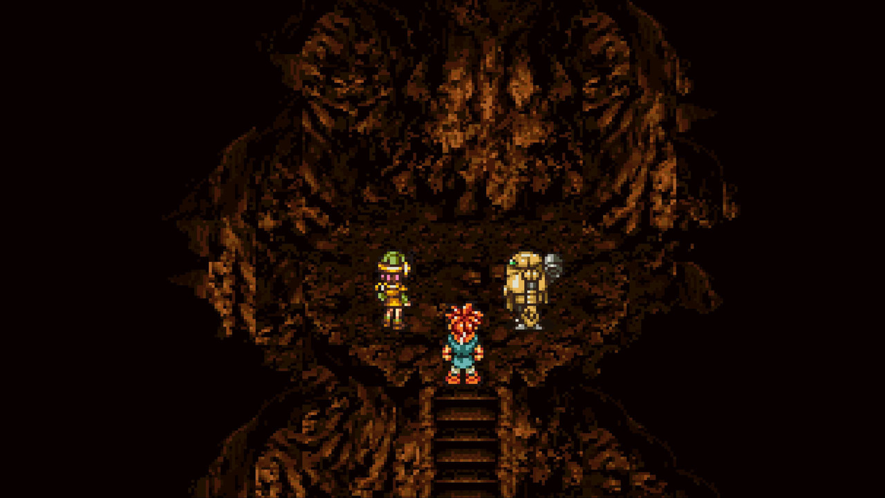 Three characters stand in a cave in Chrono Trigger.