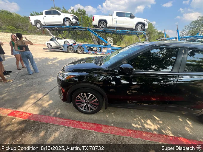 Vehicle inside enclosed transport trailer