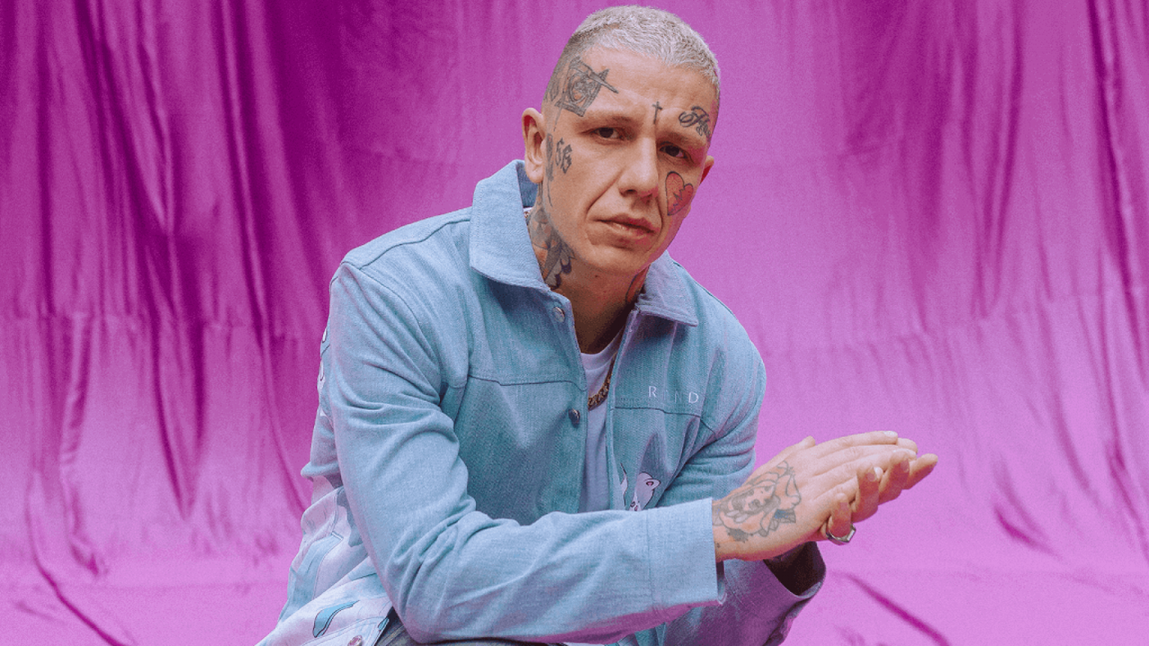 Rapper Sergei Barracuda performing for a crowd at a concert.