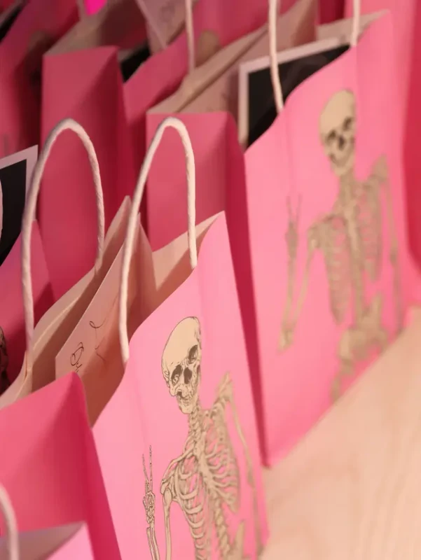 Pink skeleton goodie bags waiting for the guests