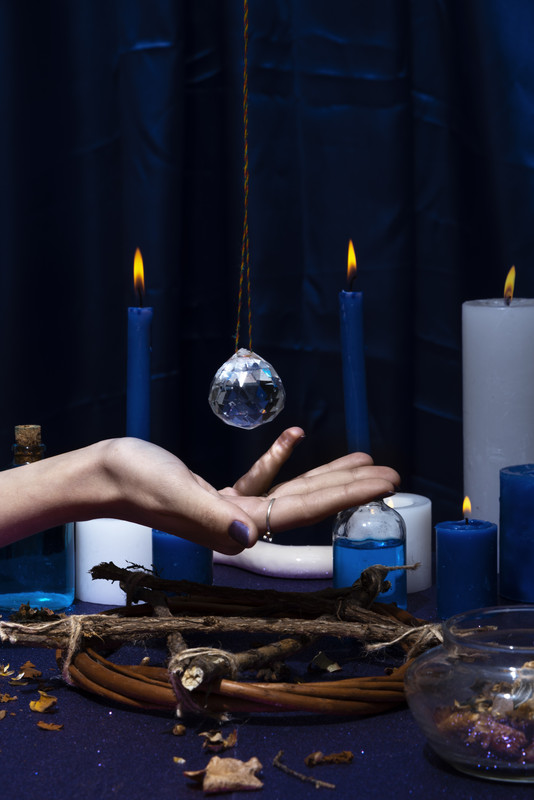 Hand. holding a crystal