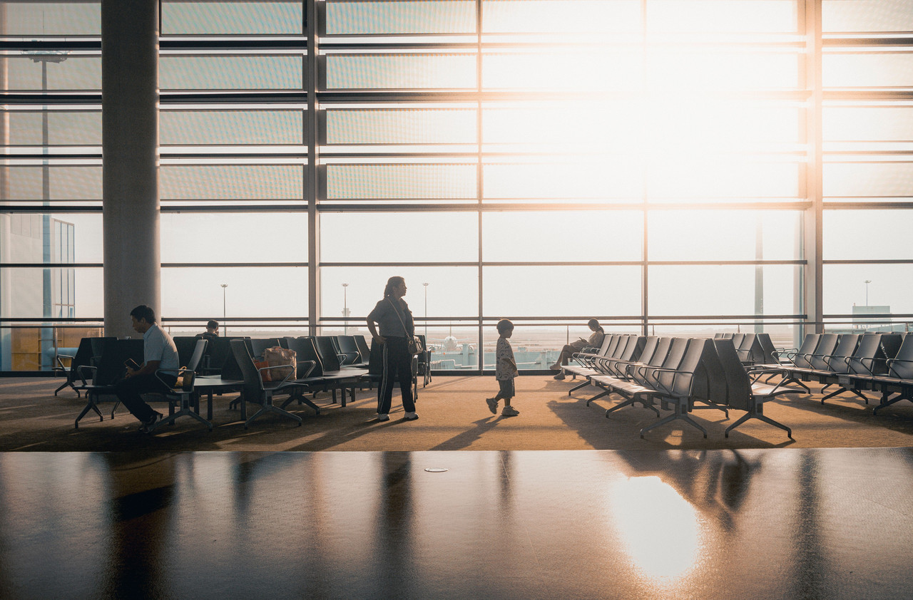 Traveler checking a flight itinerary and boarding pass with airport code MSP
