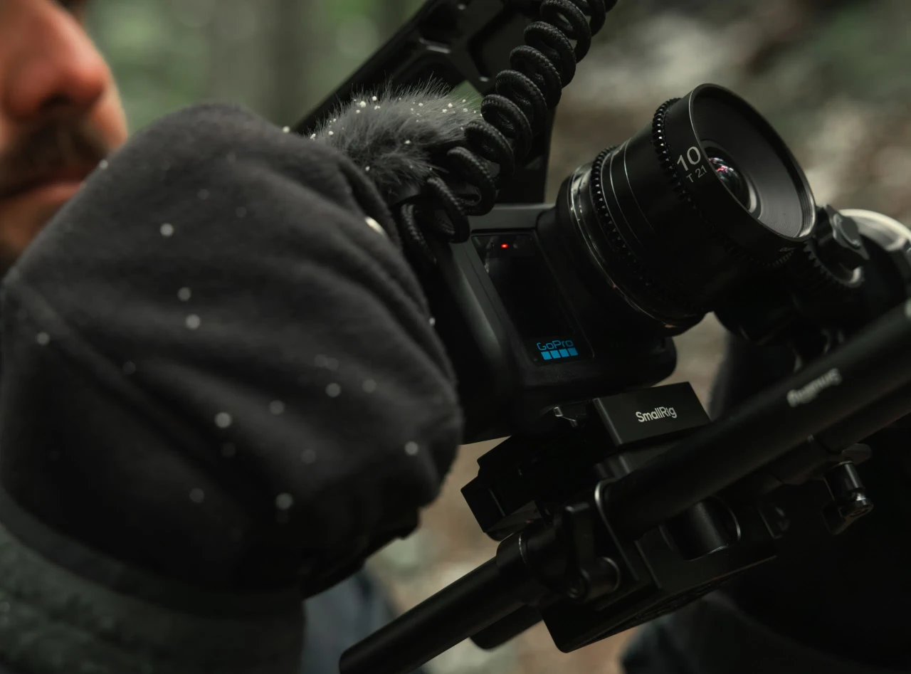 Adjusting a cine lens on the MISSION 1 PRO ILS rig in falling snow