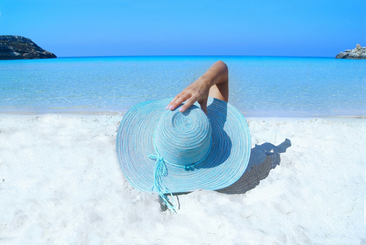 bluesunhatwhitesandybeach.jpg