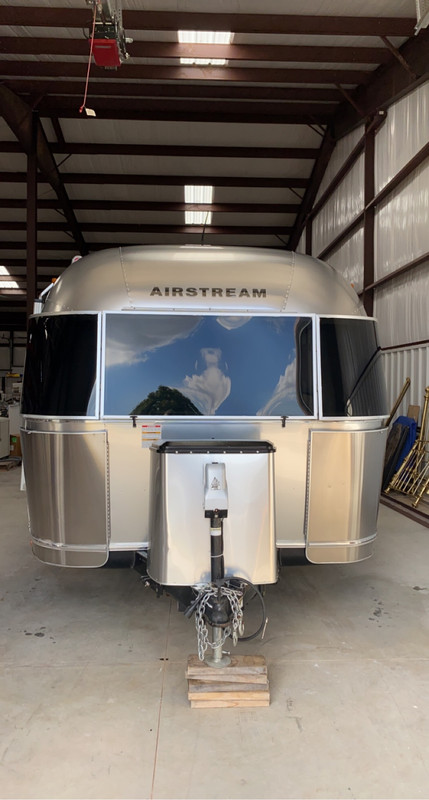 Polished section of RV sidewall showing restored gloss against the surrounding chalky, oxidized gelcoat