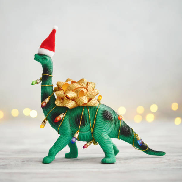 christmas-background-with-dinosaur-wrapped-in-christmas-lights-and-bow.jpg