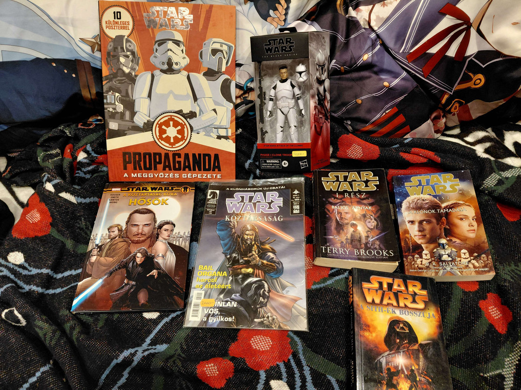 Picture of Hungarian editions of Star Wars prequel novellizations, Star Wars Propaganda Collection, comics and a Phase I trooper