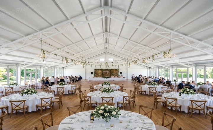 Evening view of the wedding marquee illuminated against the Provence landscape