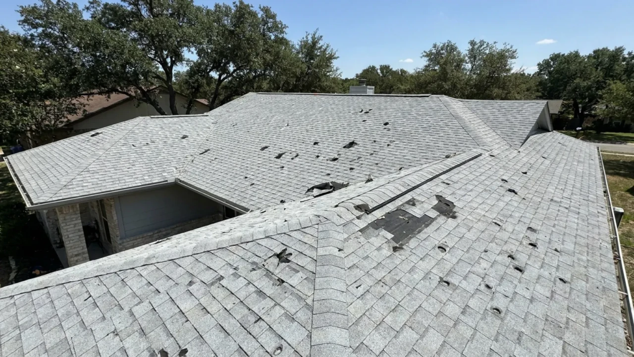 Homeowner documenting roof damage for warranty claim San Antonio Texas