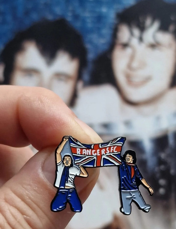 Fans on the pitch bc6947db-d4f2-429f-a62f-a55da626570c