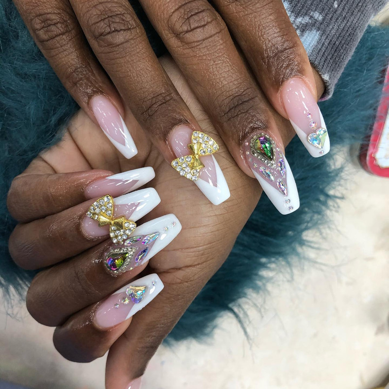 White nails with elegant bow design