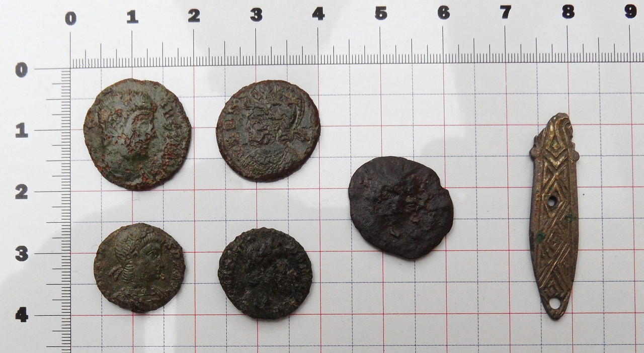 Five Roman coins and a nice gilt strap decoratio