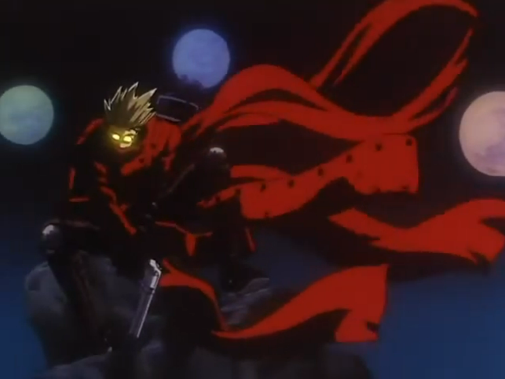 Vash from the opening of the 1998 anime, posing dramatically in the moonlight with his cloak billowing in the wind.