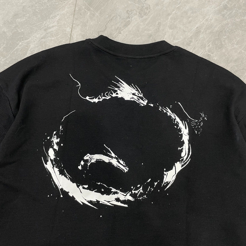Close-up detail of the ouroboros dragon print