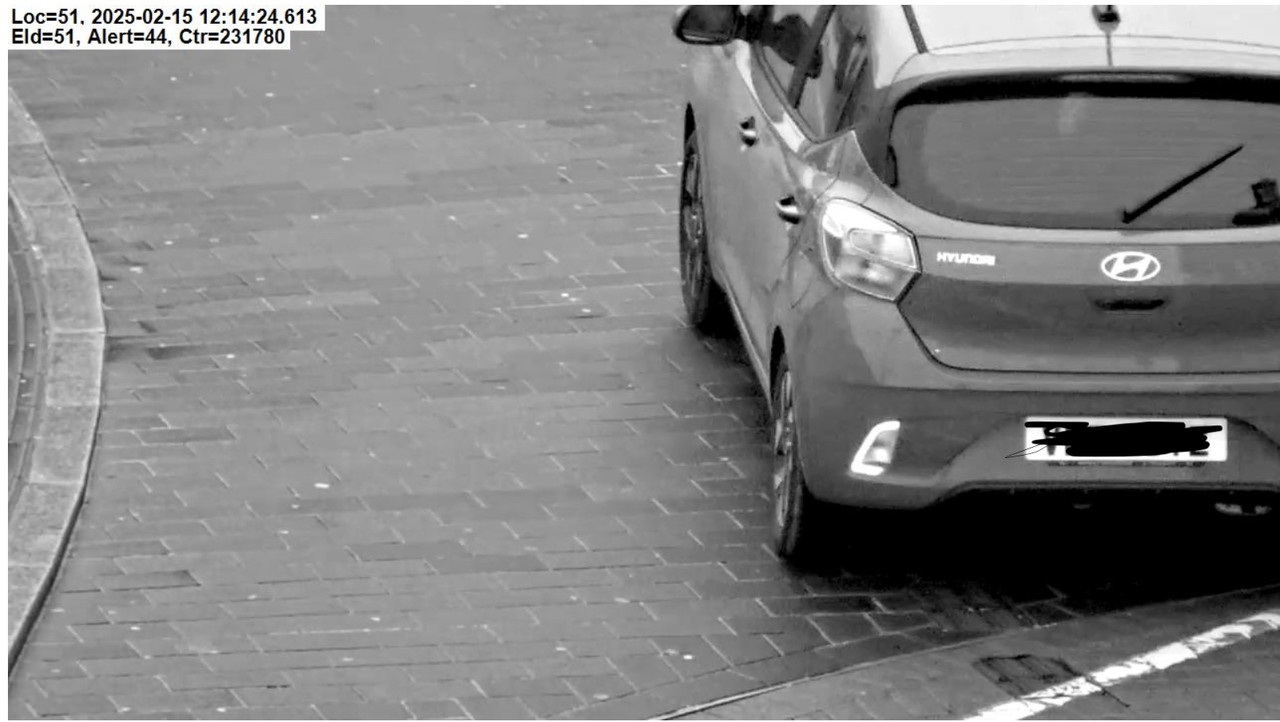 Woking Bus lane close up license plate