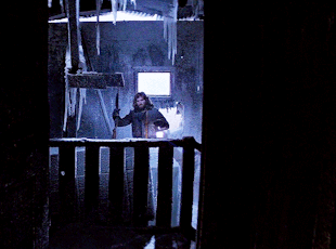 MacReady standing by the ice block that the Thing was found inside.