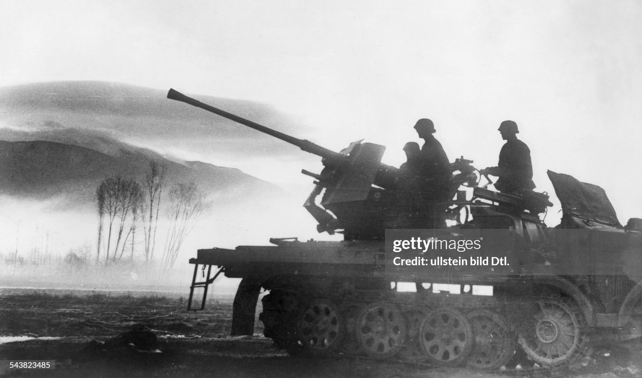 Motorized 3.7cm AA-gun (Flak43) of Waffen-SS securing the advance of german troops.April 1941