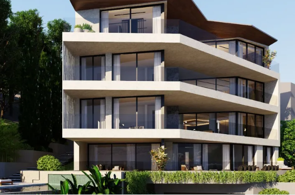 A modern house with a clean architectural design, nestled in a green landscape.