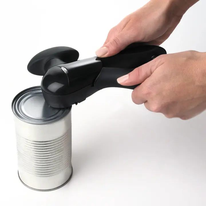 OXO Smooth Edge Can Opener in use on a can
