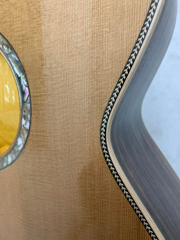 Dennis J. Siler with one of his handcrafted banjos