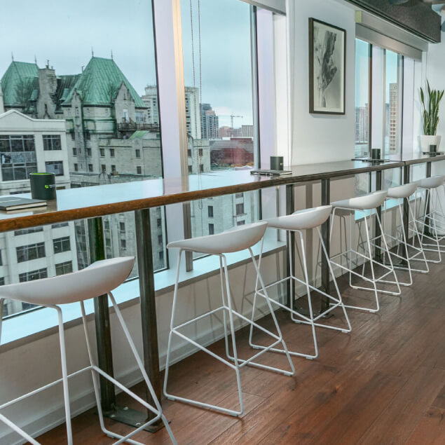 Rows of chairs and desks facing windows