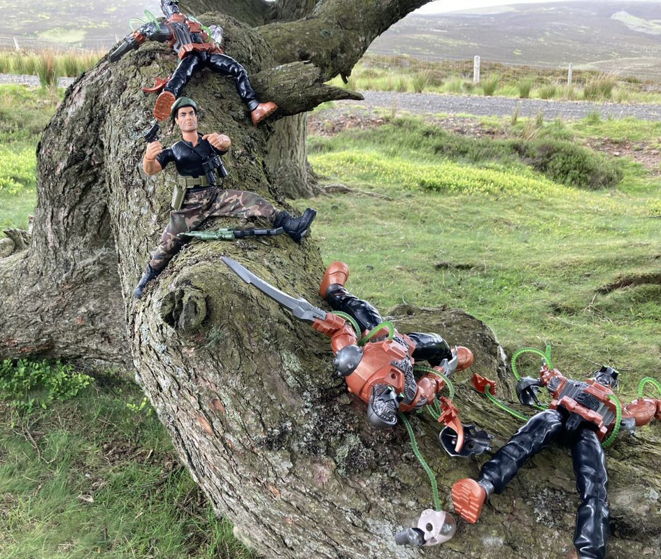 Action Man treed by a robot trio. A70-C6020-74-E1-414-C-84-D2-B103-C22-B9-AC4