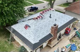 Is a metal roof cheaper than shingles near Saint Joseph Missouri?