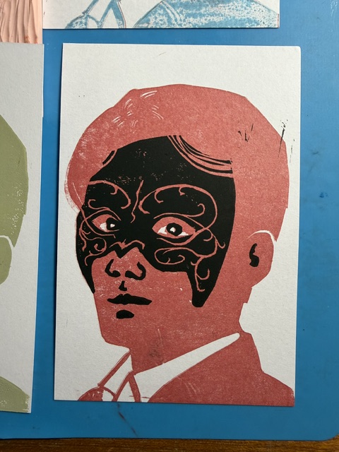 2 color red and black block print of Shen Wei wearing the Heipaoshi mask.