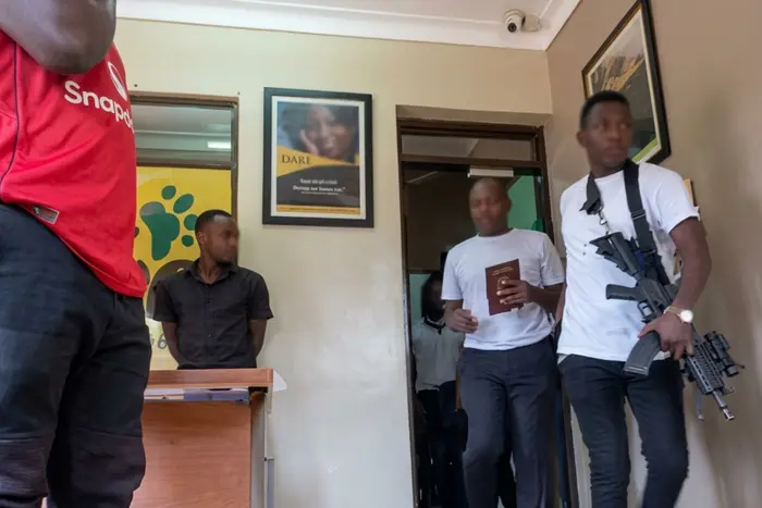 Political Analyst Charles Ramushana second from right, being dragged from Radio Simba Studio by men in civilian clothes on 5, September 2026.
