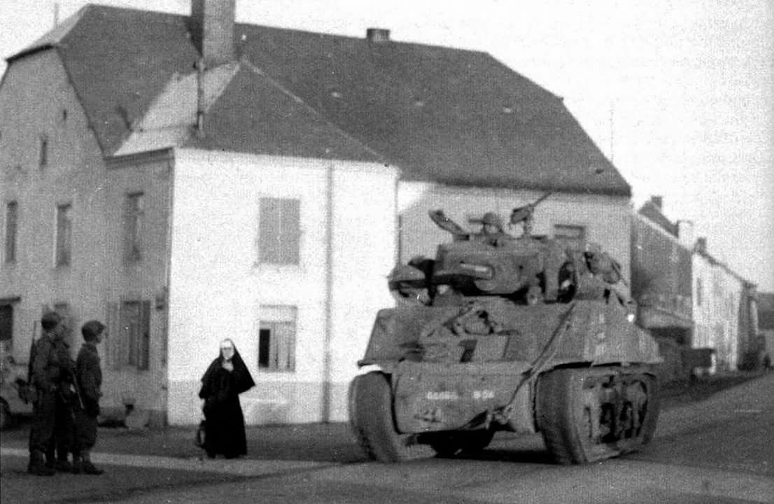 M4A3E2 Sherman Tank of Co B 68th Tank Bn 6th Armored Division passing through Habay la Neuve B