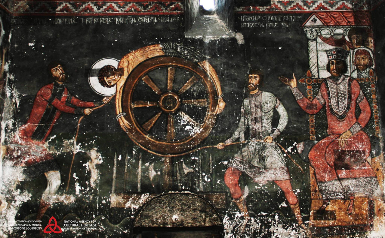 Torture_of_Saint_George_on_the_wheel._A_fresco_from_Nakipari,_Georgia._1130