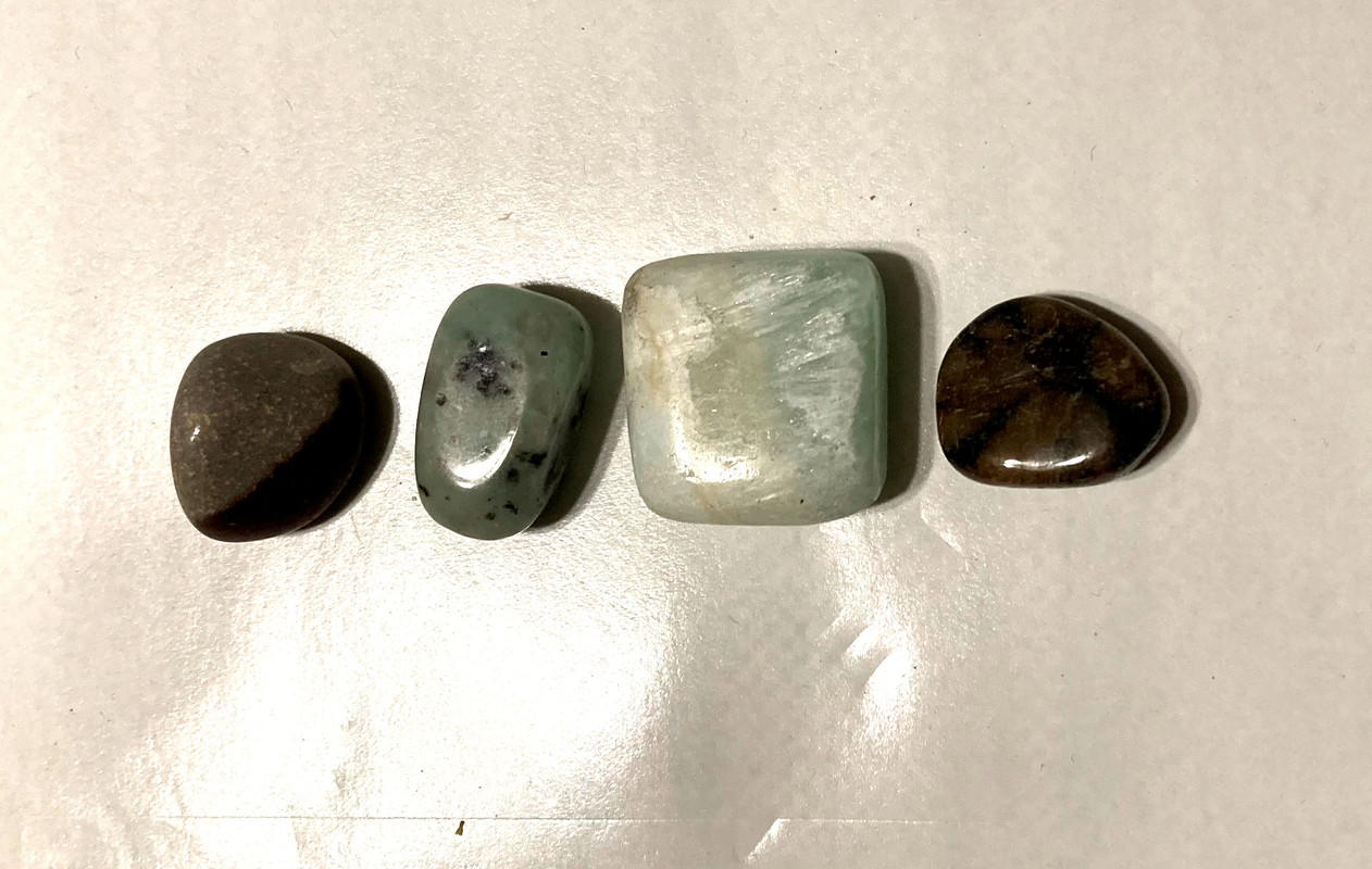 Tumbled narmada, tumbled kiwi jasper, tumbled caribbean blue calcite, tumbled chiastolite, 10 ml Forgiveness Oil, information sheet