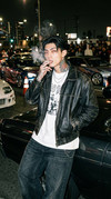 Man-leaning-against-202604062131