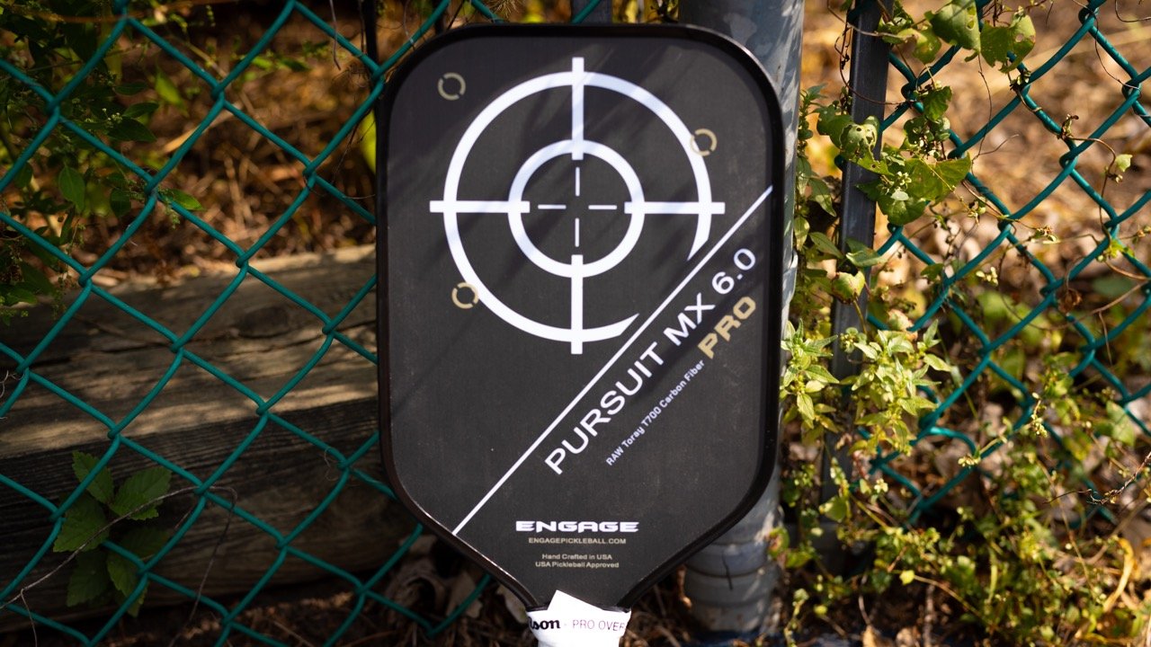 Close-up of the Engage Pursuit Pro paddle face showing the T700 carbon fiber texture.