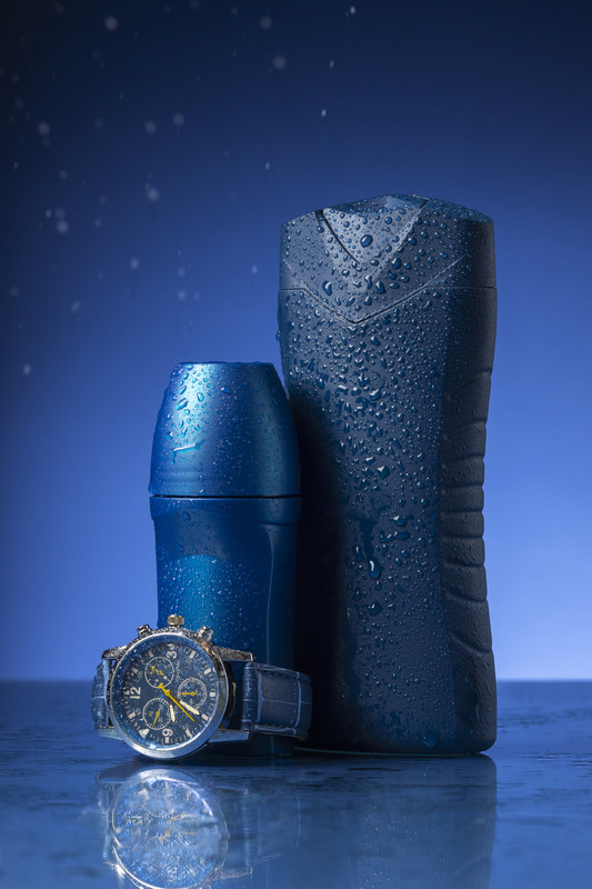 Luxury watch on black reflective surface