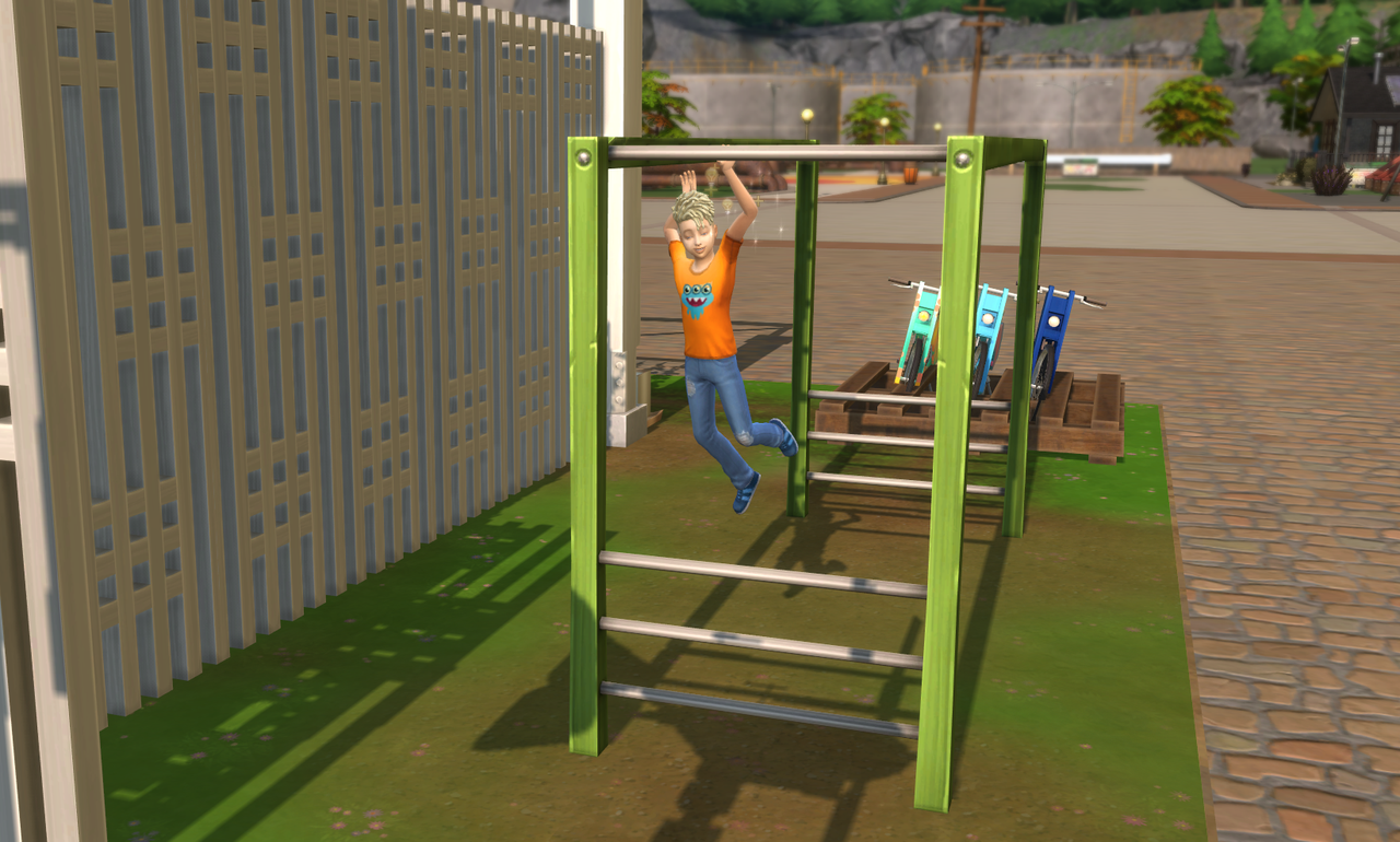 REN-HAPPILY-PLAYIING-ON-THEW-NEW-MONKEY-BARS.png