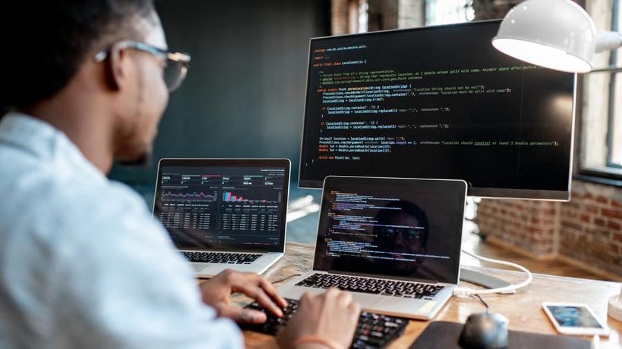 Software team reviewing an application interface and code