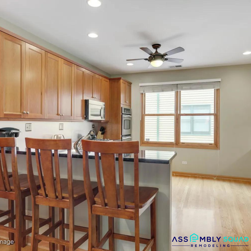 After: Transformed Lincoln Park Victorian kitchen with modern touches and preserved historical elements