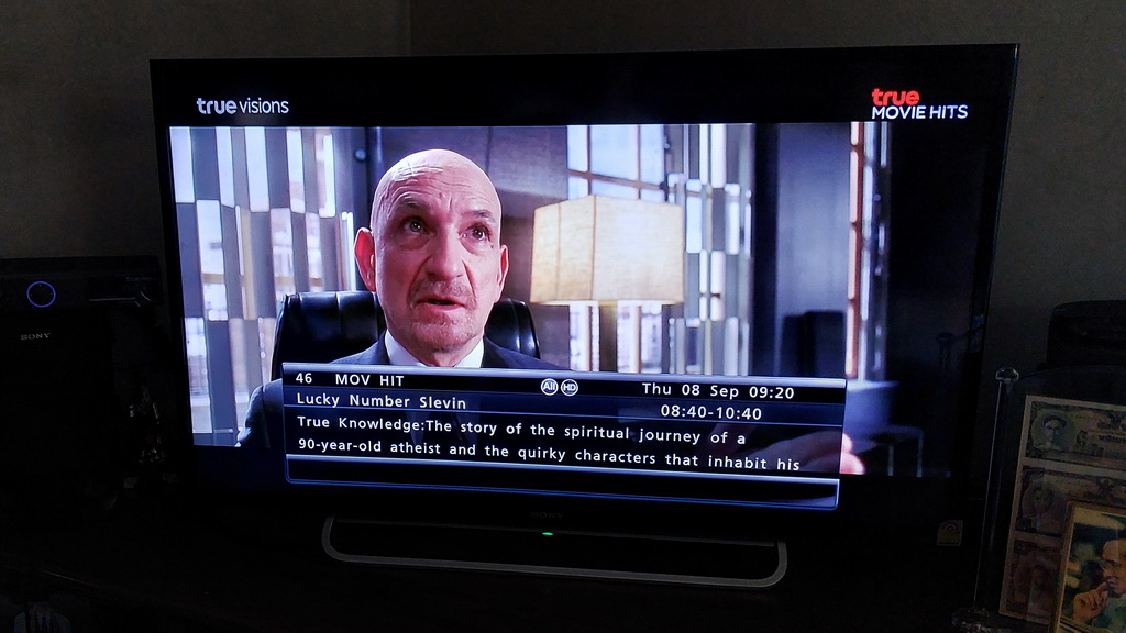 Ben Kingsley in a scene from Lucky Number Slevin, with the same errant synopsis at the bottom of the screen