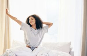 black-woman-morning-stretching-and-waking-up-in-home-bedroom-after-sleeping-or-resting-relax-pea-300.jpg