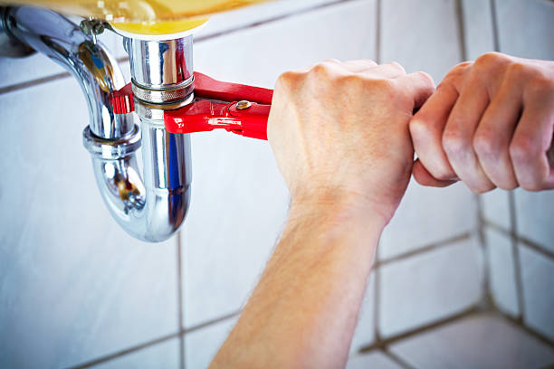 professional plumber fixing sink