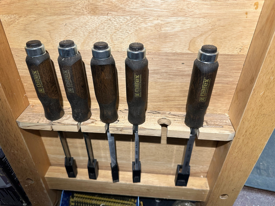 The ends are recessed which leaves a good place to store tools like these mortise chisels.