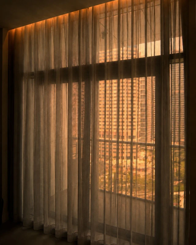 Sheer curtain washed by the integrated rail light