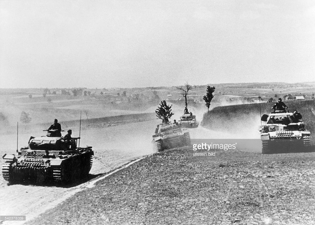 german tanks (III) advancing along a country roa