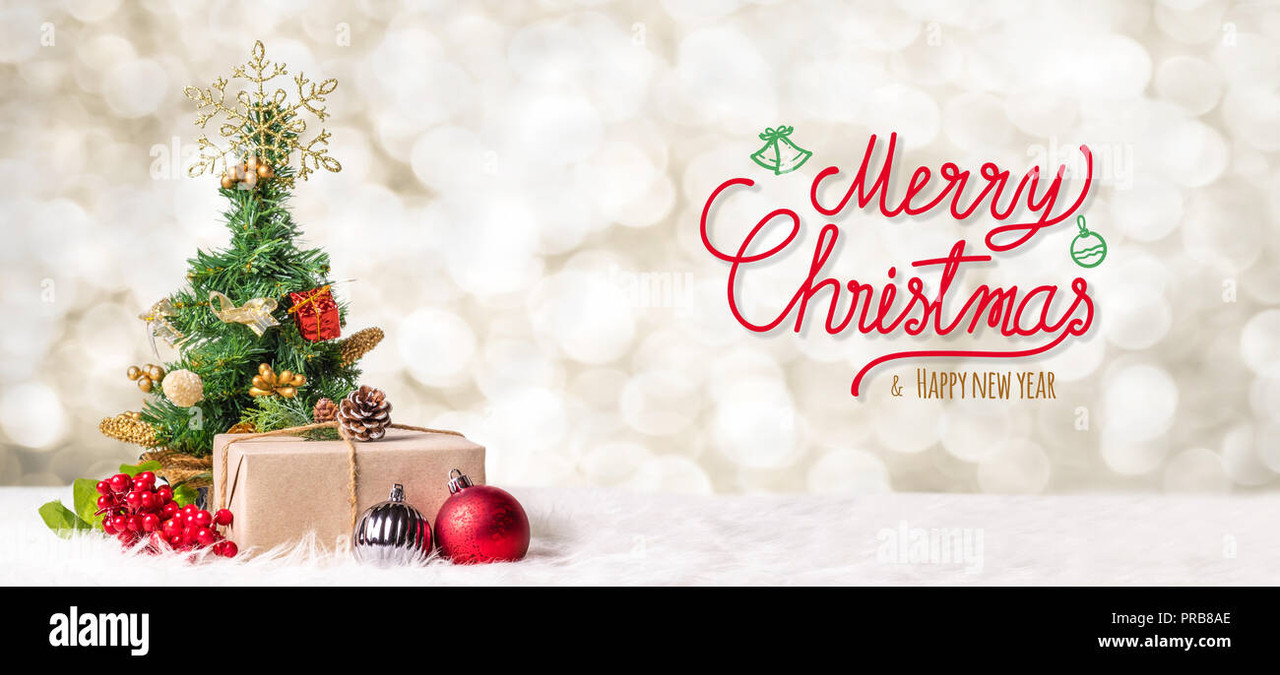 red-merry-christmas-and-happy-new-year-handwriting-with-xmas-tree-and-gift-box-at-blur-bokeh-light-b